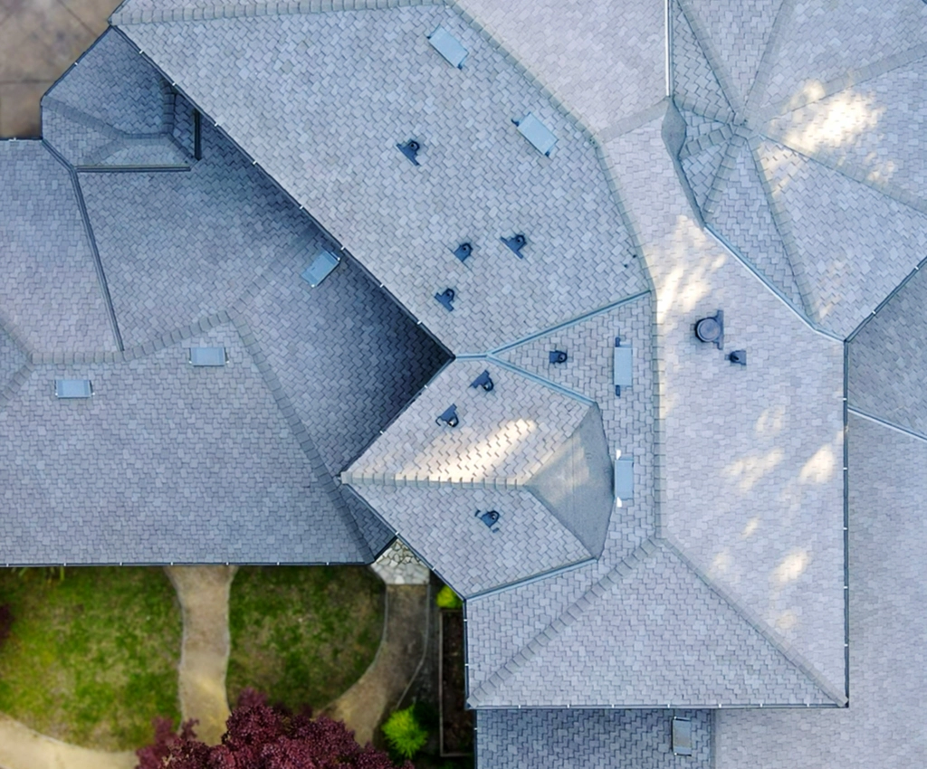 Aerial view of a large residential roof replacement with new gray shingles completed by Tri Valley Roofing.
