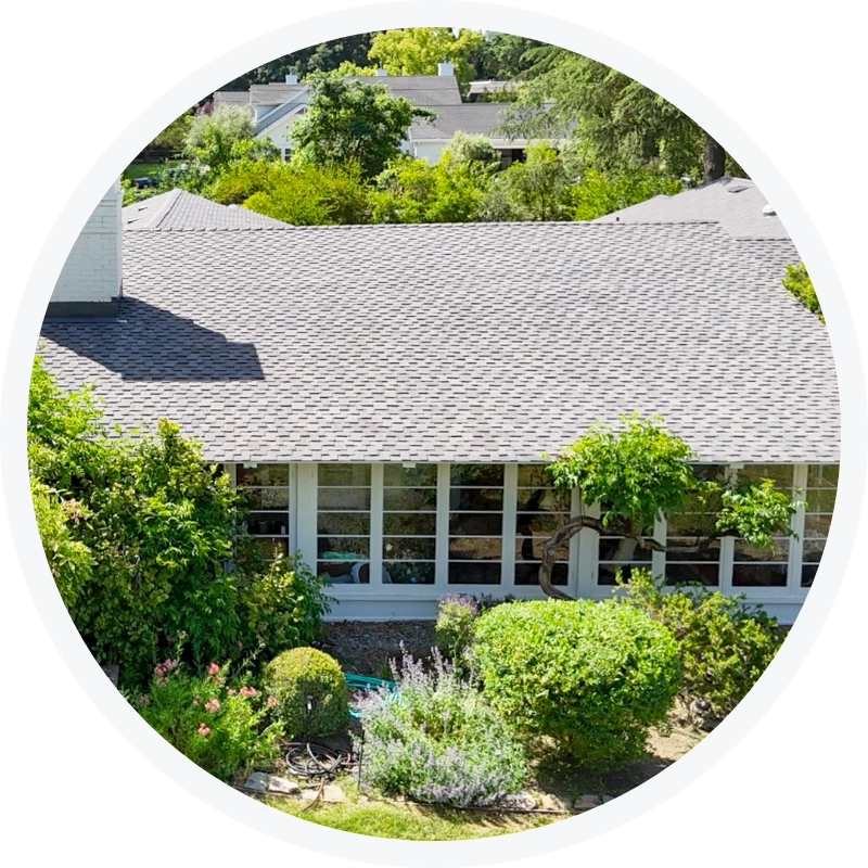 Completed roof replacement on a residential home with new gray shingles by Tri Valley Roofing.
