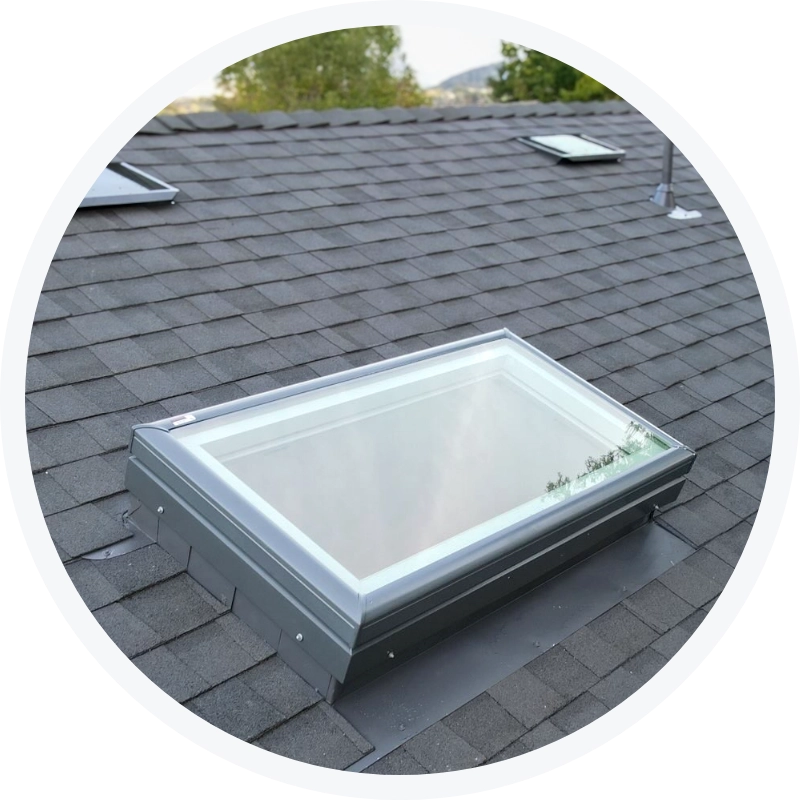 New rectangular skylight installed on a gray shingle roof by Tri Valley Roofing.